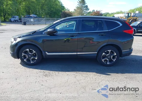 2018 Honda Cr-V Touring z USA, uszkodzony, nr VIN 7FARW2H91JE088570
